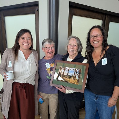 Executive Director Rika Ayotte, Board President Ann Richardson, 2025 Lifetime Achievement Award winner Carol Wall, and Community Engagement Director Sarah Mowry. Photo: Land Trust.